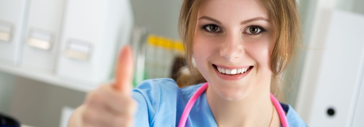 Medical Assistant giving a thumbs-up sign