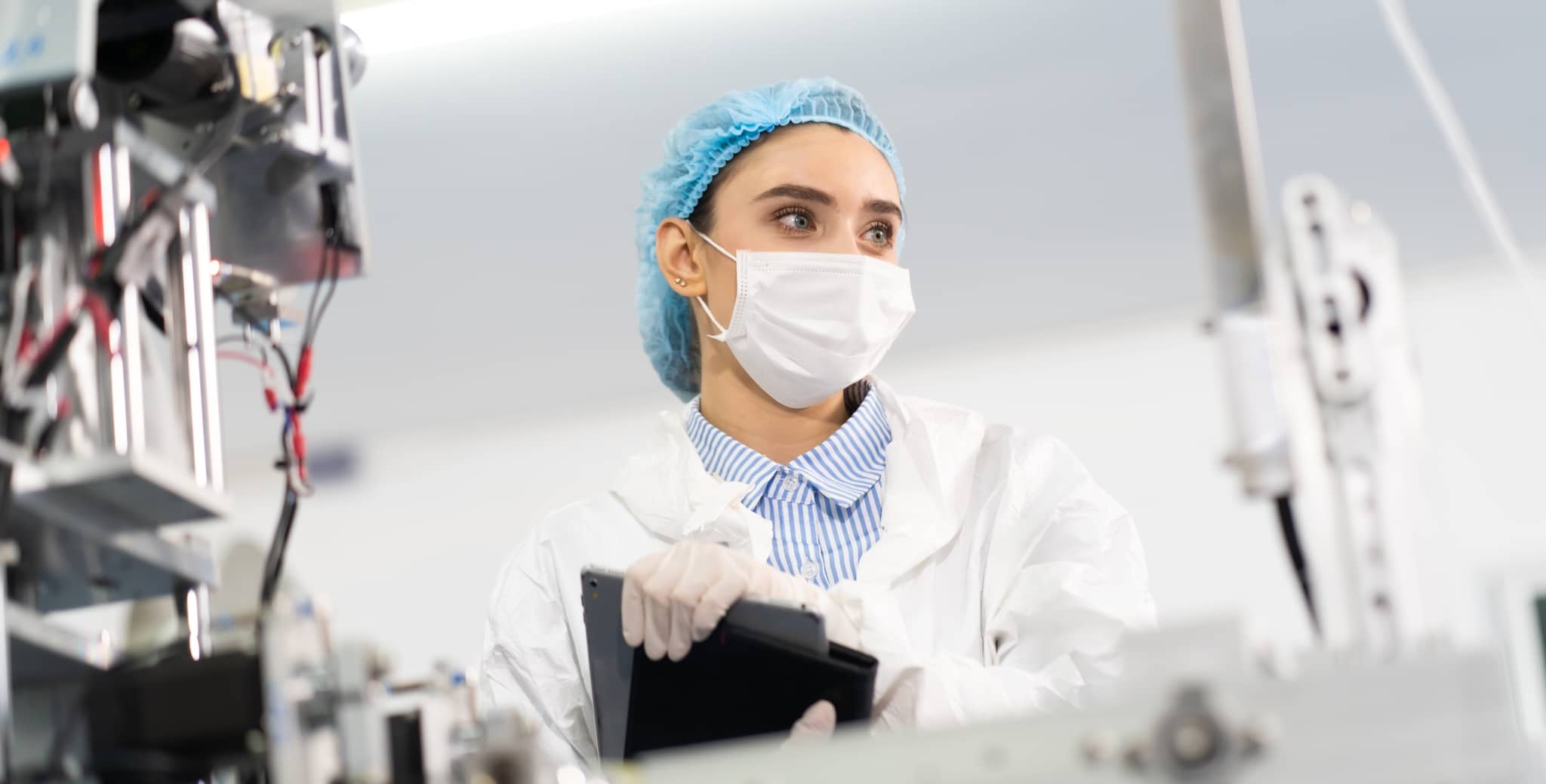 Female manager in mask and sterile clothes