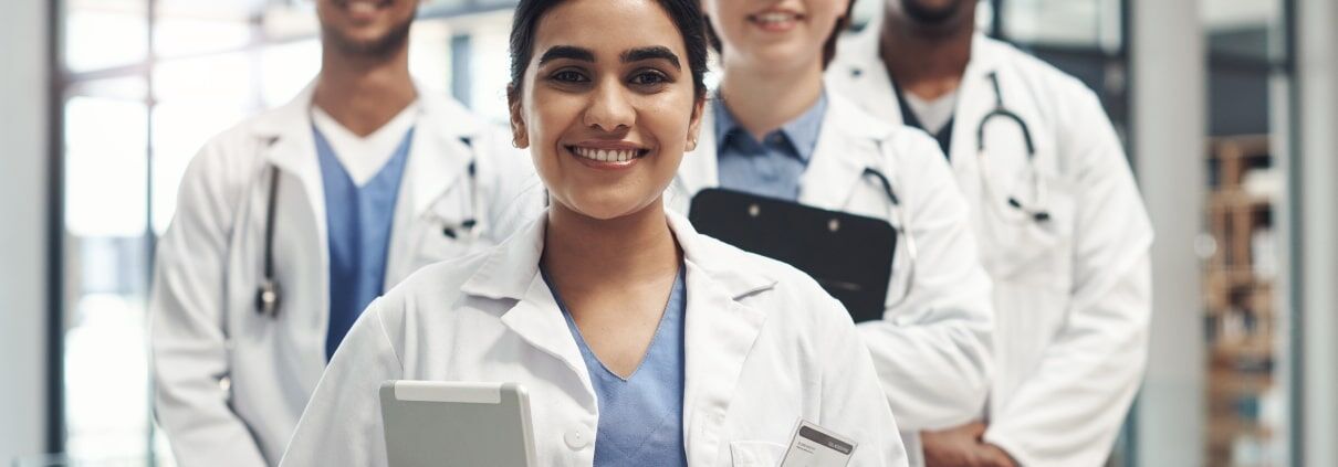 Diverse group of medical professionals with clipboards