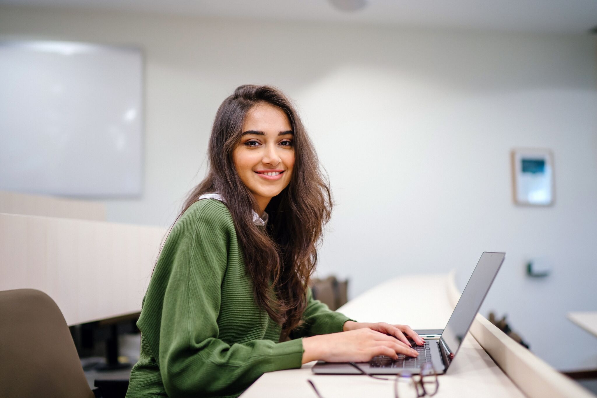 Smiling female student in a classroom