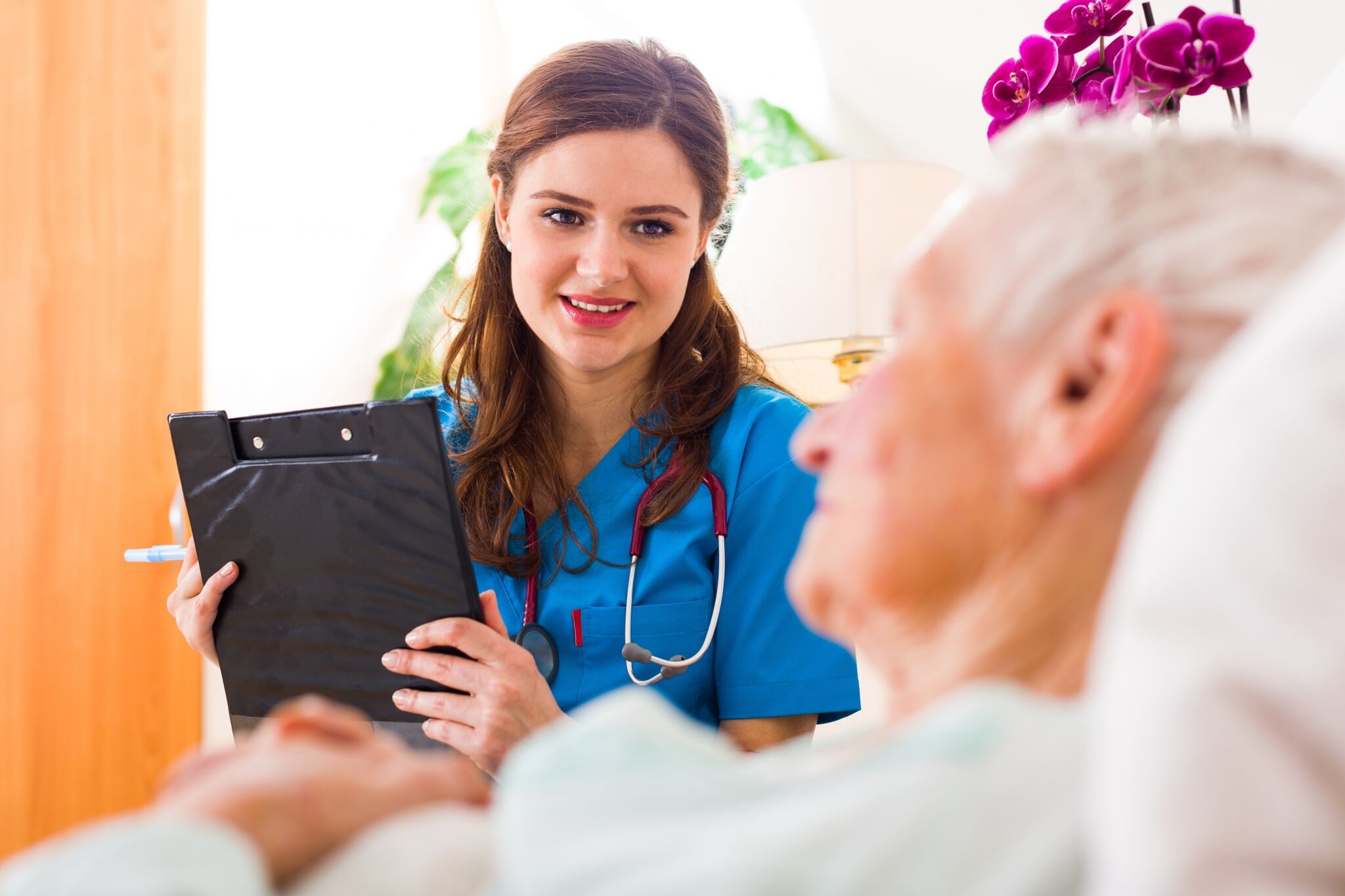 Registered Nurse smiling at a patient