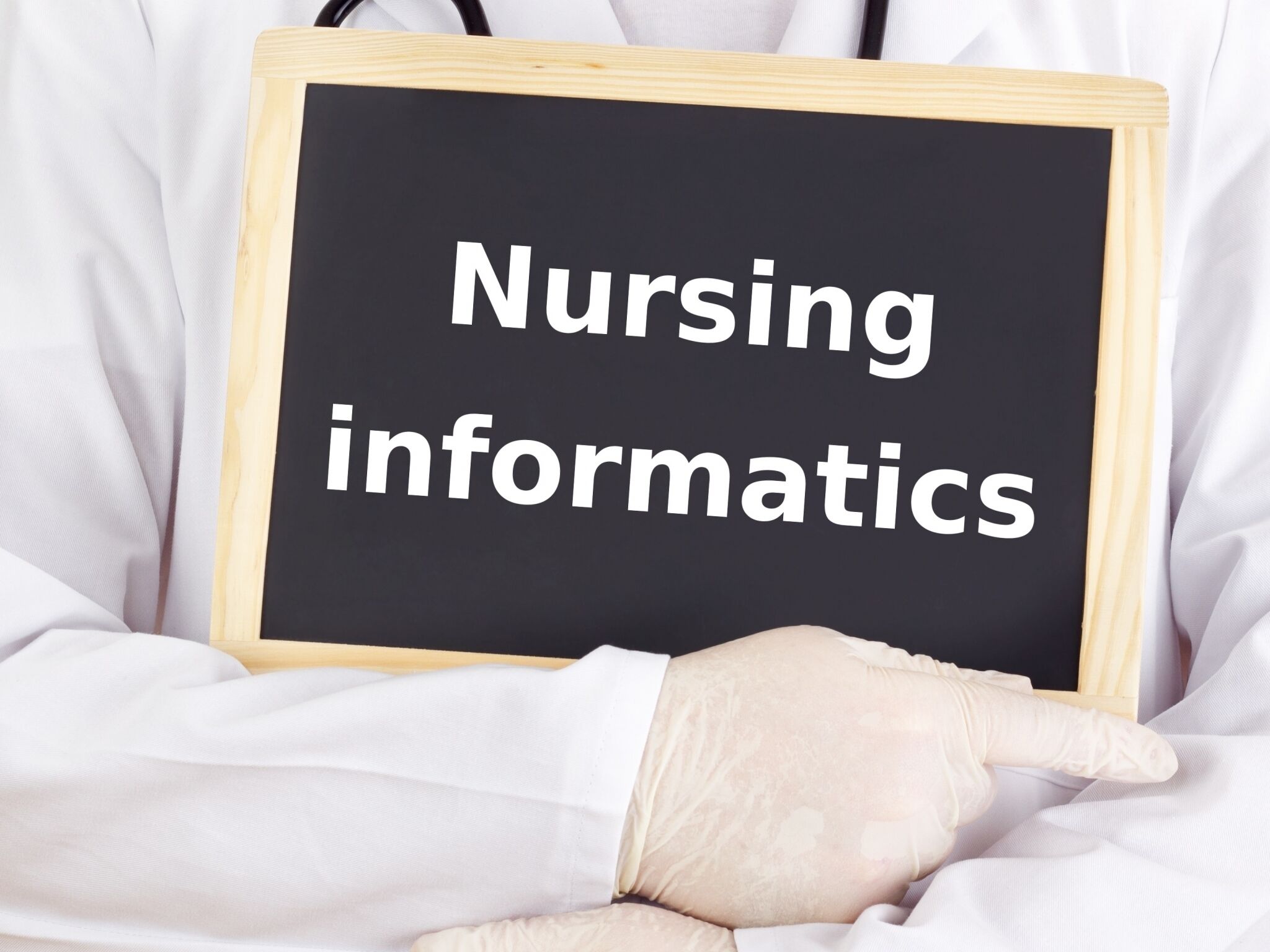 Medical professional holding nursing informatics sign