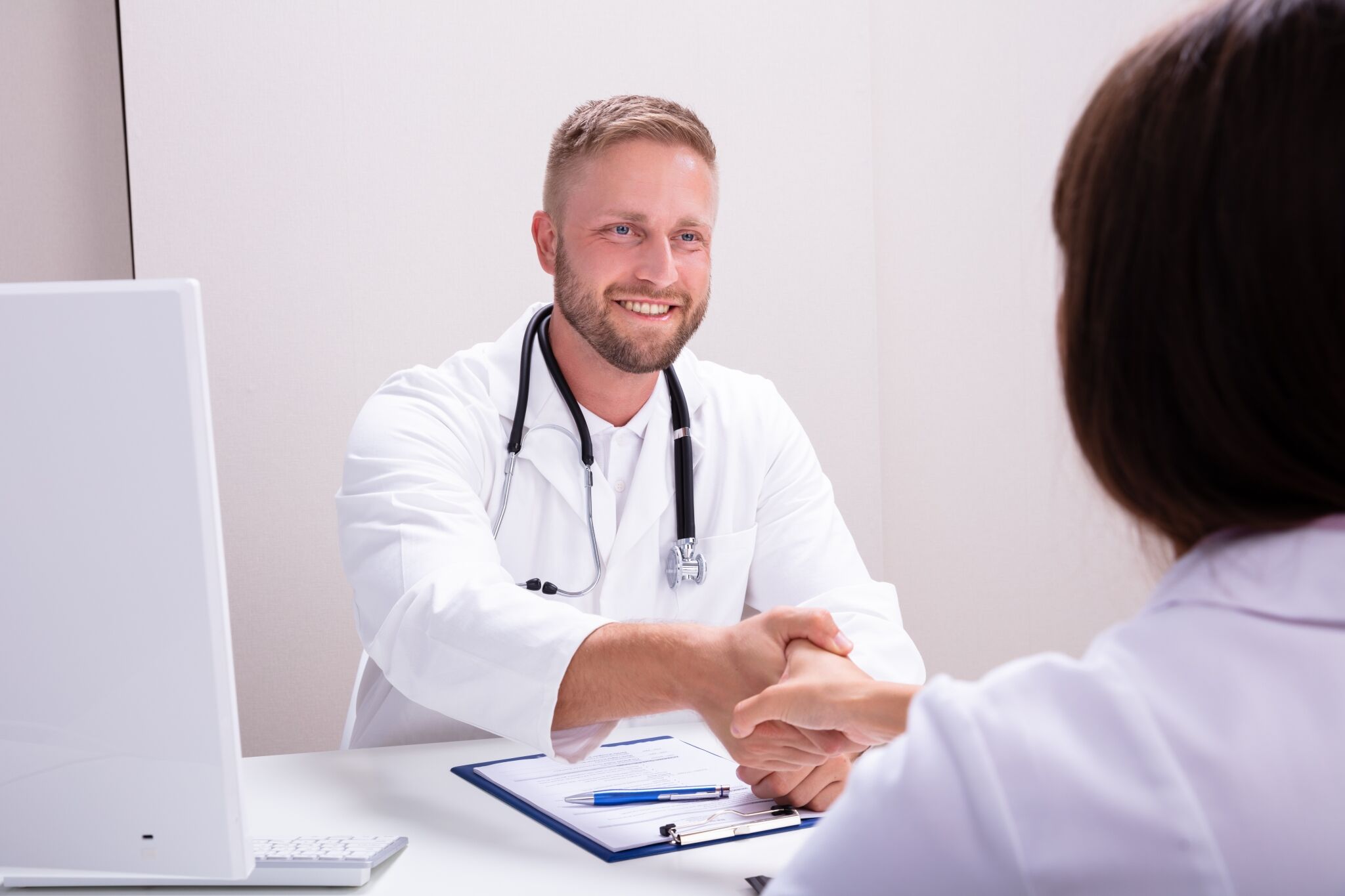 Nurse recruiter shaking a woman's hand