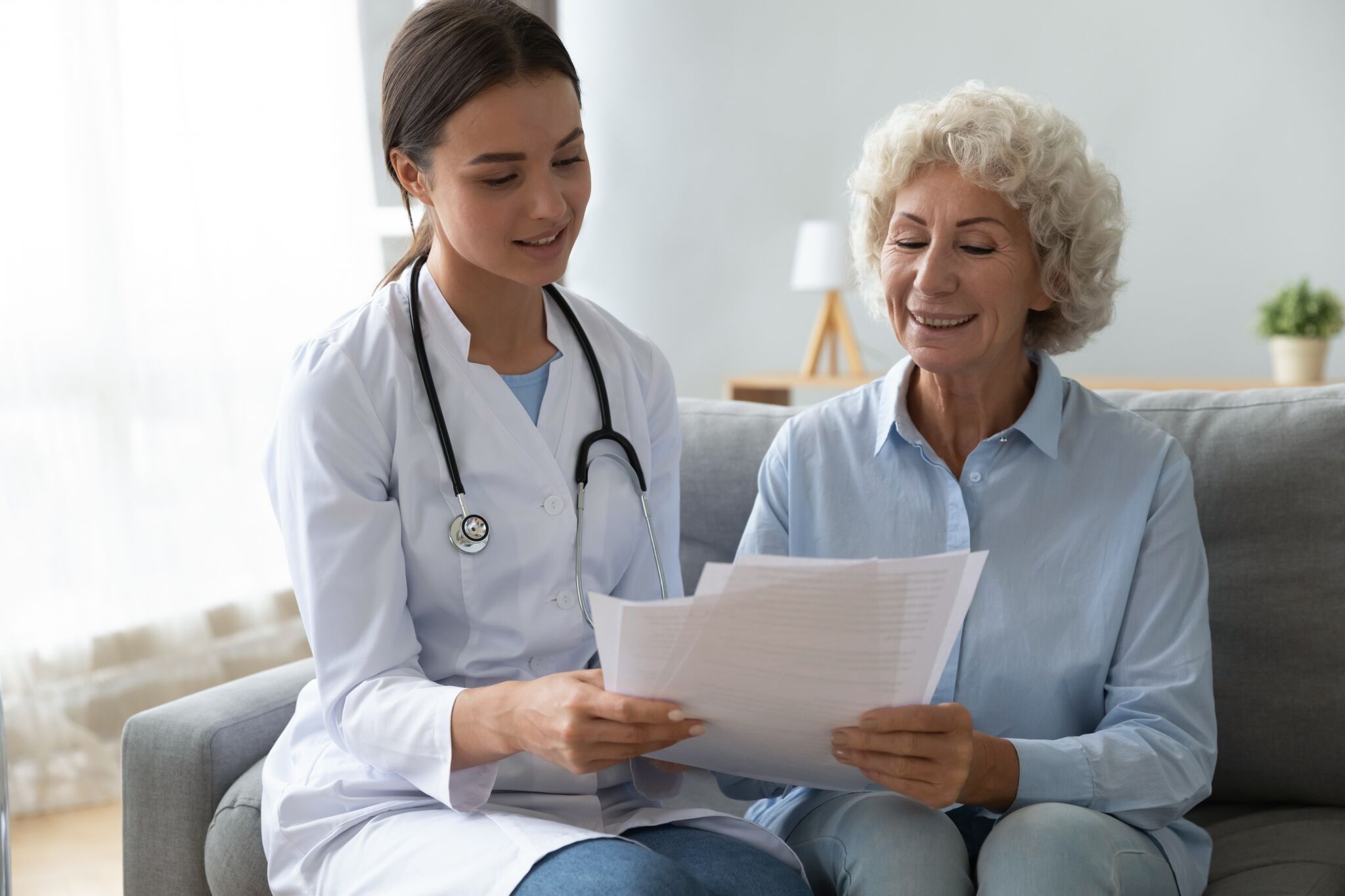 Medical professional with an elderly patient