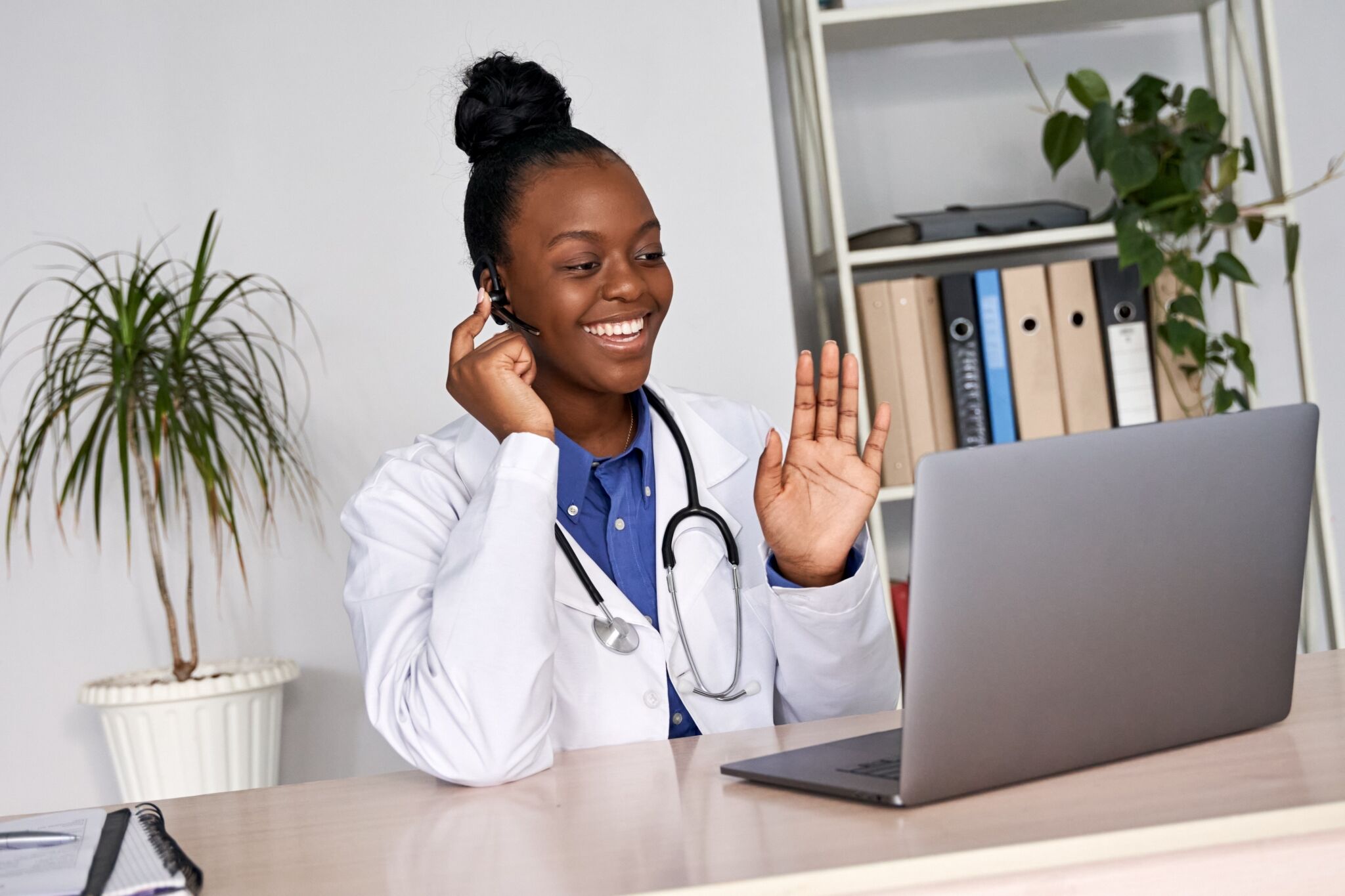 African-American nurse using a headset