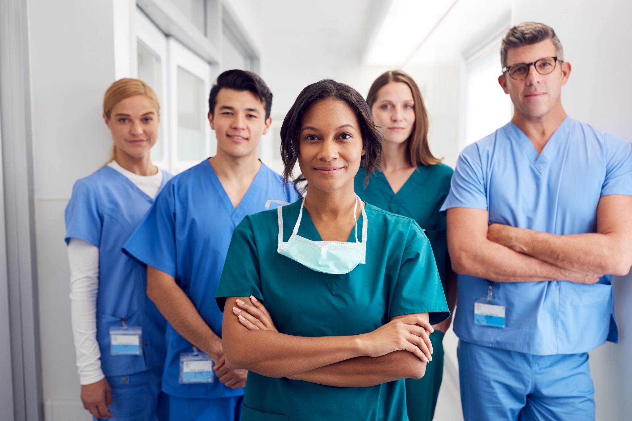 Medical team smiling in a hallway