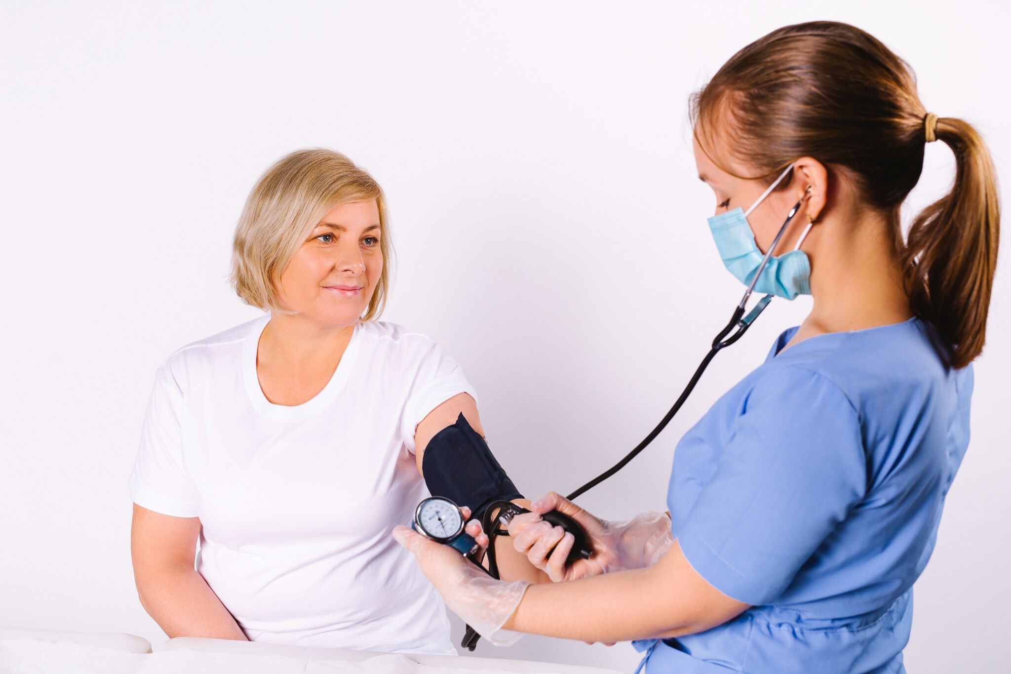 Medical Assistant taking vital signs.