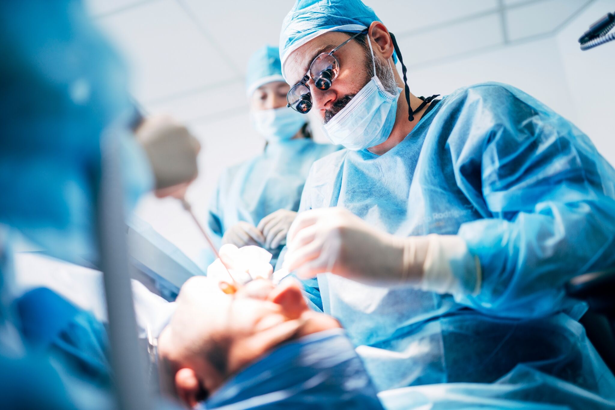 Team of dental surgeons working on a patient