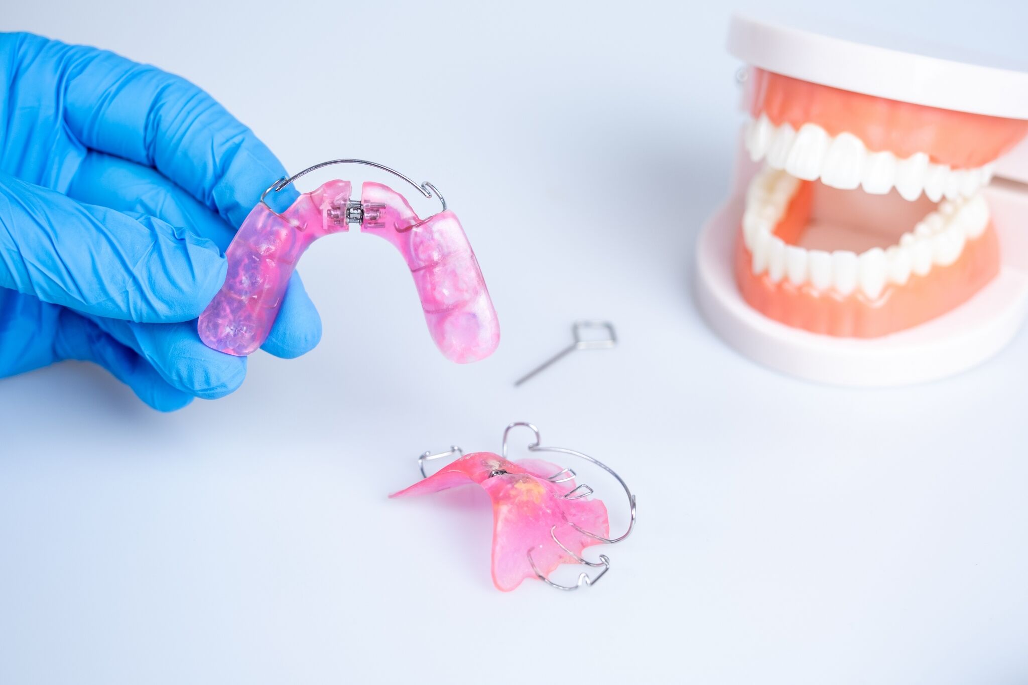 Dentist holding a dental device