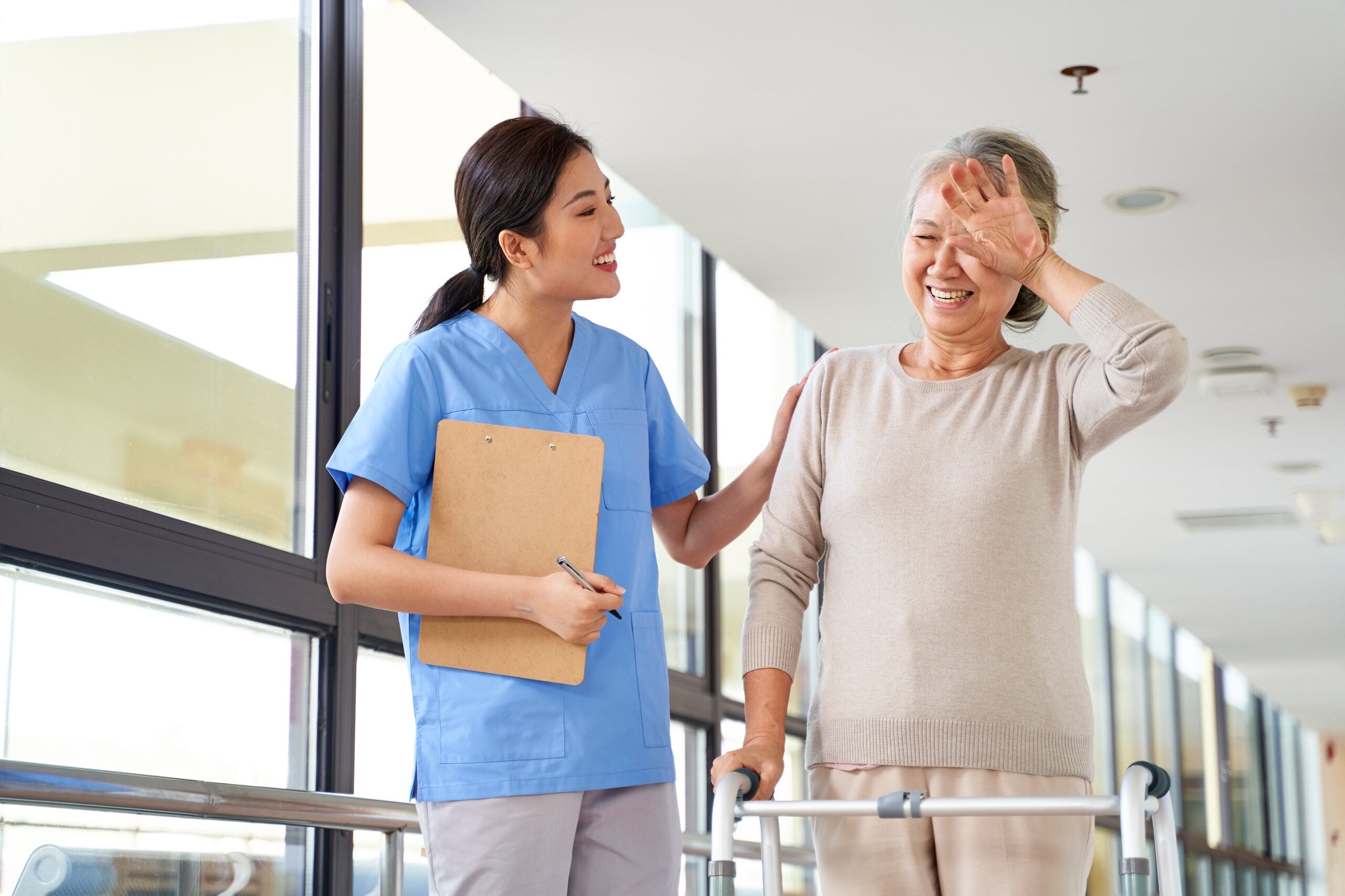 Female medical professional with elderly woman