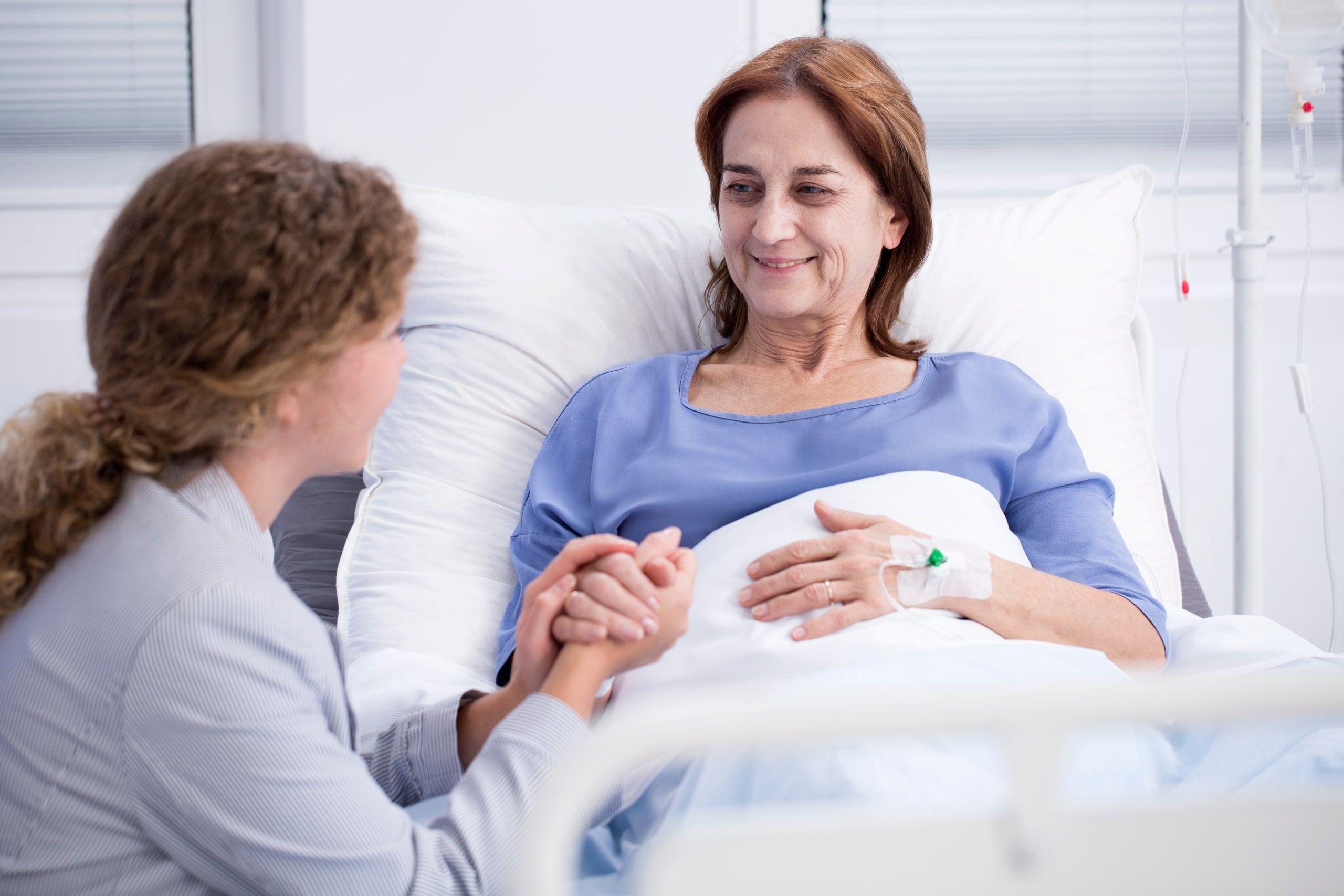 Nurse comforting a sick patient