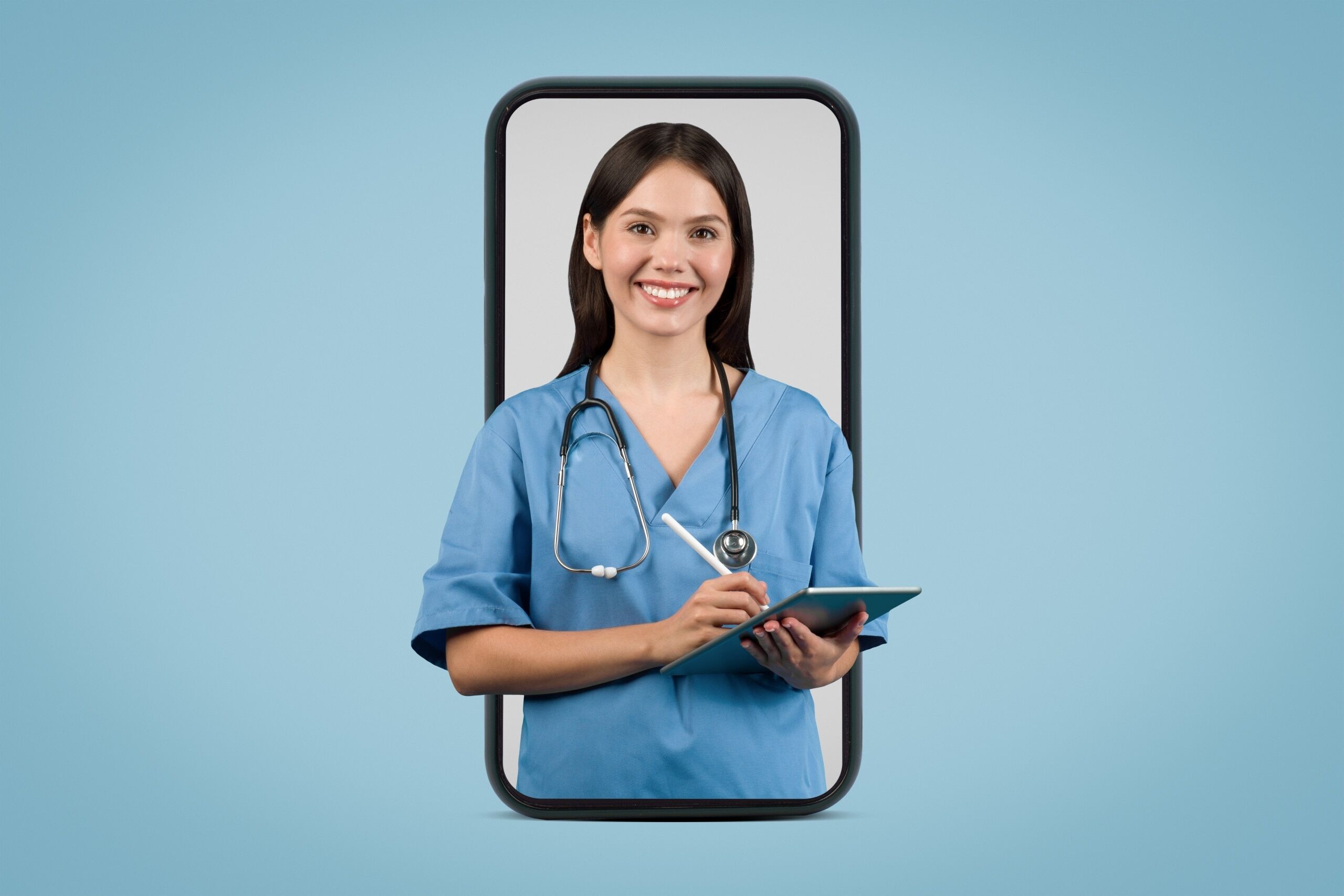 Nurse in scrubs holding a tablet while standing in the frame of a smart phone