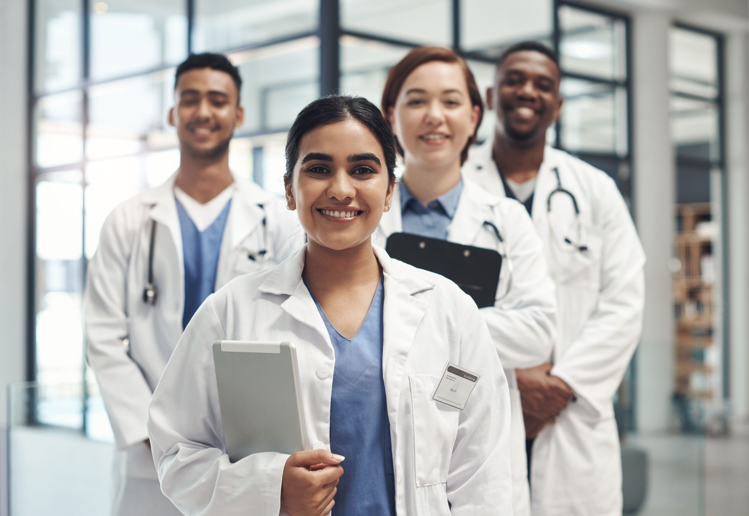 Diverse group of medical professionals with clipboards