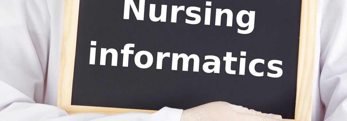 Medical professional holding nursing informatics sign